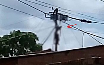 Homem fica pendurado em poste após ser eletrocutado