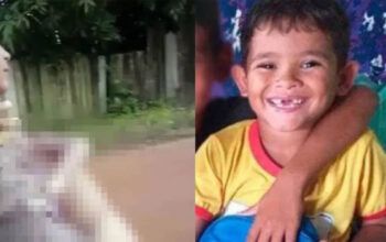 Mãe carrega o filho de 5 anos morto por crianças enquanto brincavam de peteca - vídeo