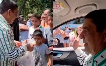 Zeca Pagodinho é confundido com Martinho da Vila ao distribuir doces de Cosme e Damião